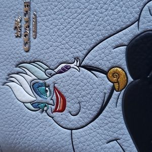 NWT DISNEY X COACH Corner Zip Wristlet with Ursula Motif.